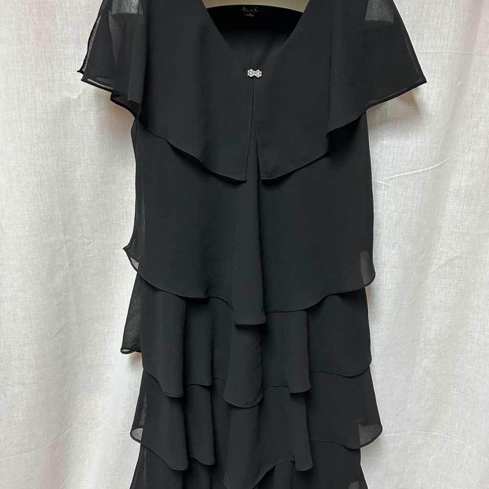 Black tiered sassy dress 
Cruise 
Hem 40” 23” armpit to armpit flat 
Size 18 - Picture 3 of 13